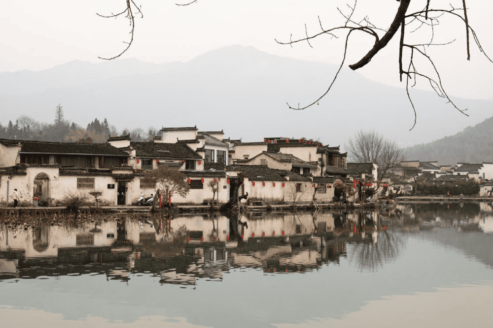 Fenghuang Ancient Town stands out with its stilt houses lining the gentle Tuojiang River (Source: Pexels)
